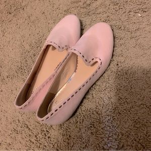 Selling a pair of lovely pink shoes.